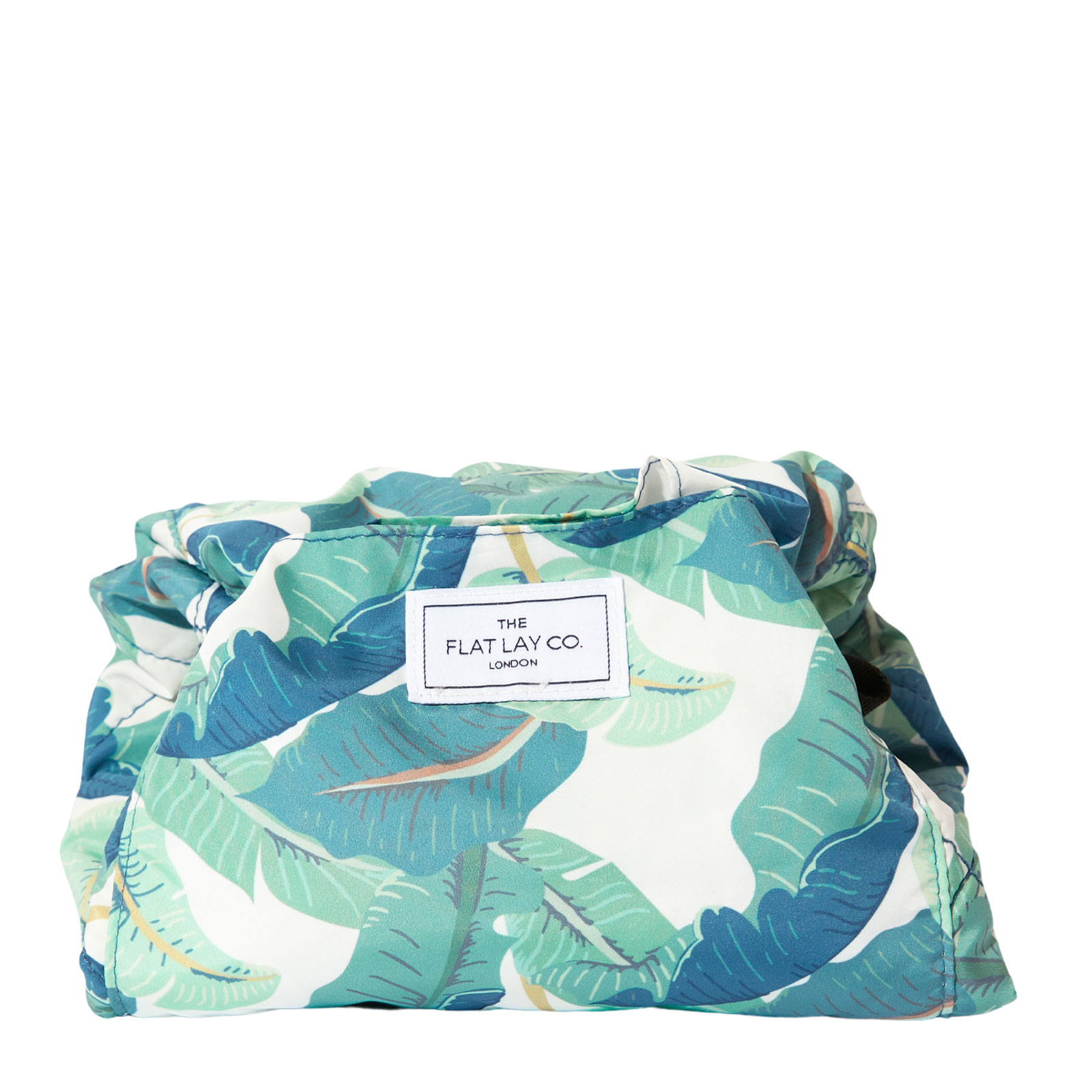 The Flat Lay Co. Open Flat Makeup Bag in Tropical Leaves